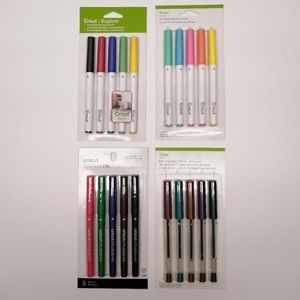 Four unopened packages of Cricut pens